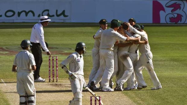 Under question ... the Australians celebrate their unexpected win over Pakistan in the New Year Test.     Majeed allegedly claims to have fixed the result.