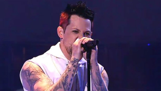 Joel Madden kicks off the performance of <i>Sing</i> by <i>The Voice</i> coaches.