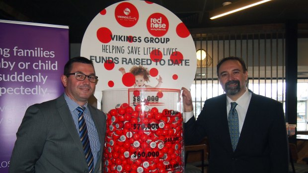 Vikings Group CEO Anthony Hill with Red Nose CEO Theron Vassiliou at the $80,000 handover in Canberra on Wednesday.