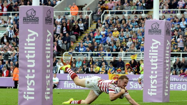 NEWCASTLE UPON TYNE, ENGLAND - MAY 30:  Joe Burgess of Wigan Warriors scores a try during the Super League match between Leeds Rhinos and Wigan Warriors at St James' Park on May 30, 2015 in Newcastle upon Tyne, England.  (Photo by Nigel Roddis/Getty Images) Joe Burgess. Picture: getty Images