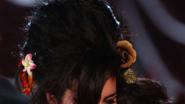 'She seemed out of it' ... Amy Winehouse hugs her mother Janis.