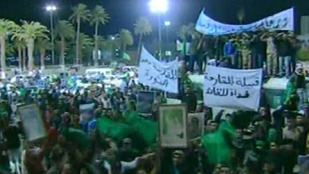 An image grab taken off Libya's state television station shows what the channel said were supporters of Libyan leader Muammar Gaddafi