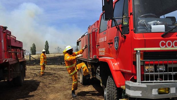 As the temperature rises, so do the fires ... the Rural Fire Service deals with a bushfire on Mount Forest Road near Cooma.