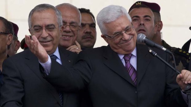Good to be back ... Mahmoud Abbas, right, and the Palestinian Prime Minister, Salam Fayyad, during a ceremony held to welcome Mr Abbas's return.