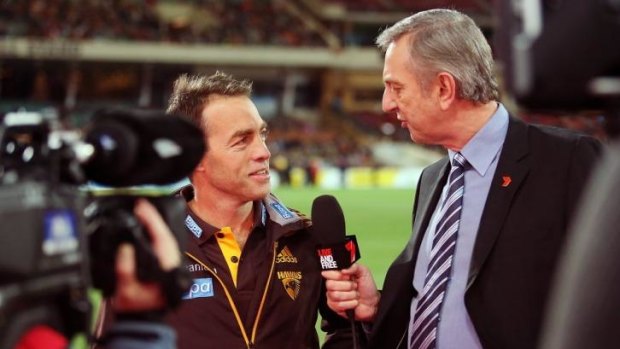 Hawthorn coach Alastair Clarkson is interviewed by Dennis Cometti of Channel Seven before the game.