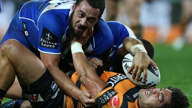 Stay down ... Adam Blair is tackled by Sam Kasiano.