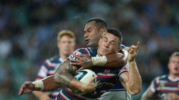 It's Williams on Williams: Roosters forward Sonny Bill Williams is tackled by Canterbury's Tony Williams.