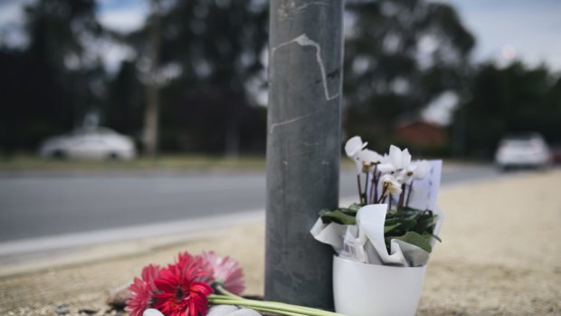 Flowers have been left at Ian 'Scrubby' Stokes' spot at the Northbourne Avenue and Antill Street intersection where he washed windscreens for many years.