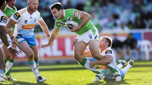 Pulled up short ... David Shillington tried to break through the Titans' line.