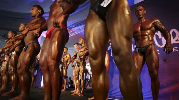 Striking a pose: Competitors strut their stuff at the International Federation of Bodybuilding and Fitness Australia National Championships.