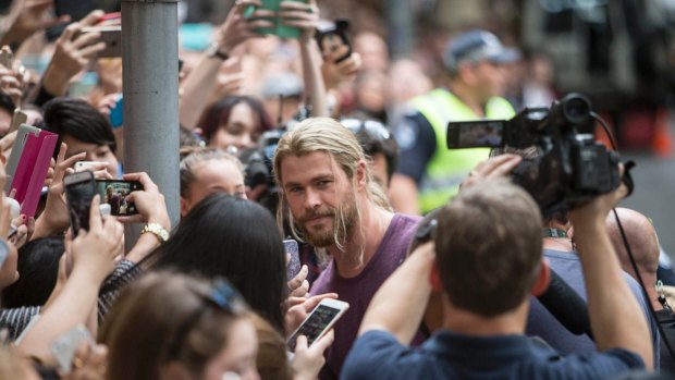 Hemsworth is mobbed by fans on the streets of Brisbane.