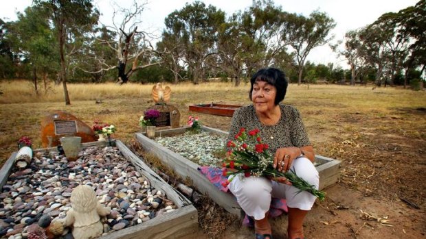 Lorraine 'Bunta' Patten at the grave of Aunty Edna Brown.