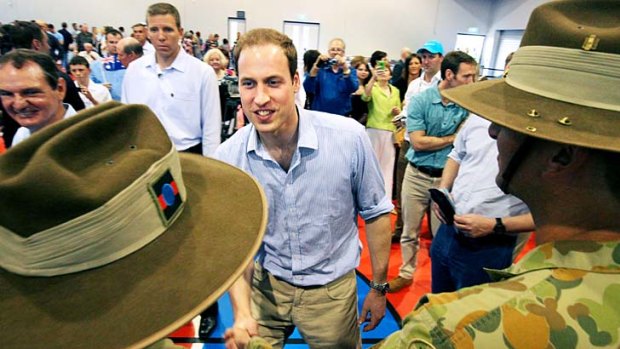 Prince William greets members of the Australian Army who were involved in helping with the flood recovery.