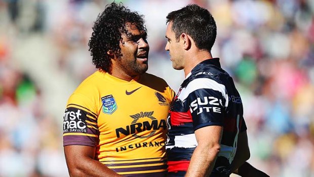 Congratulations: Sam Thaiday of the Broncos shakes hands with Brad Fittler of the Roosters.