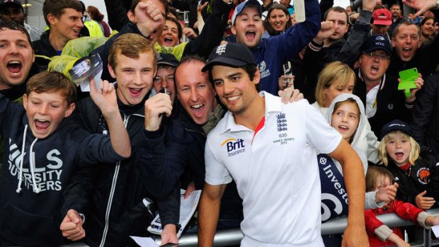 Job done: England captain Alastair Cook, celebrates with fans.