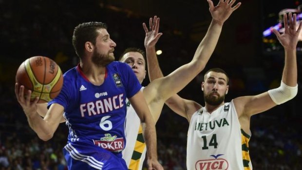 France's guard Antoine Diot gets a pass away.
