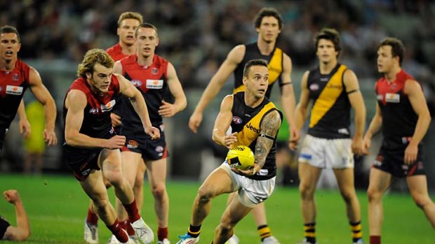 Catch him if you can: Tiger Jake King clears away from Demon Jack Watts.