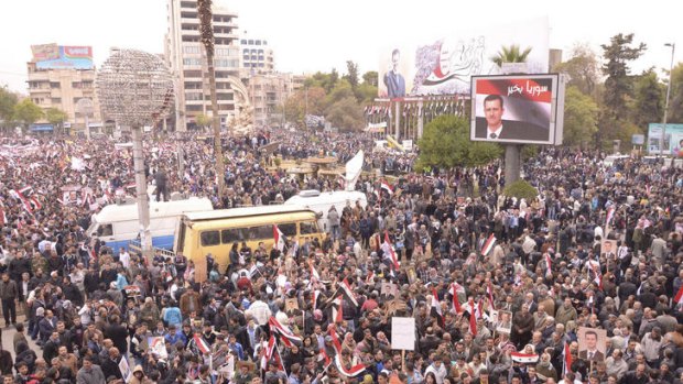 Supporters of Syrian President Bashar al-Assad's gather during a rally in Aleppo in November 2011.