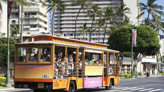 Riding the Ala Moana Shopping Centre Trolley down Kalakaua Avenue in Waikiki.