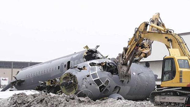 A 40-year-old Northwest Airlines McDonnell Douglas DC9-30 aircraft is demolished at Midway Airport in Chicago. Tim Zemanovic, the head of Aircraft Demolition, a company that tears down and recycles unwanted airplanes, says his five-year-old business has never been stronger as airlines expand and replenish their fleets with fuel-efficient planes.