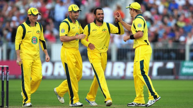 Australian bowler Fawad Ahmed, second from right, has declined to wear alcohol sponsorship on his shirt due to his religious beliefs.