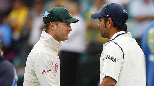 Michael Clarke shakes hands with M. S. Dhoni after the Test ended.