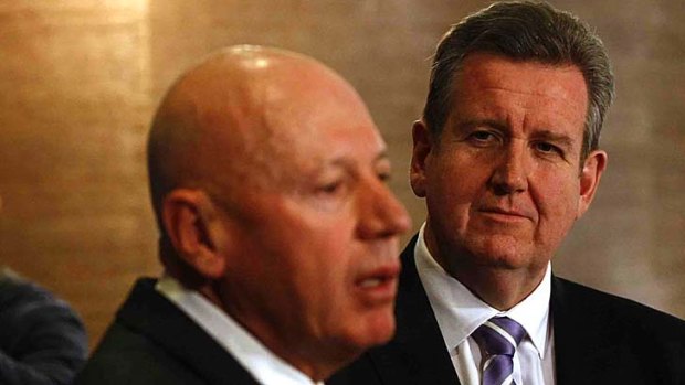 Finger-pointing ... Energy Minister Chris Hartcher and Premier Barry O'Farrell.