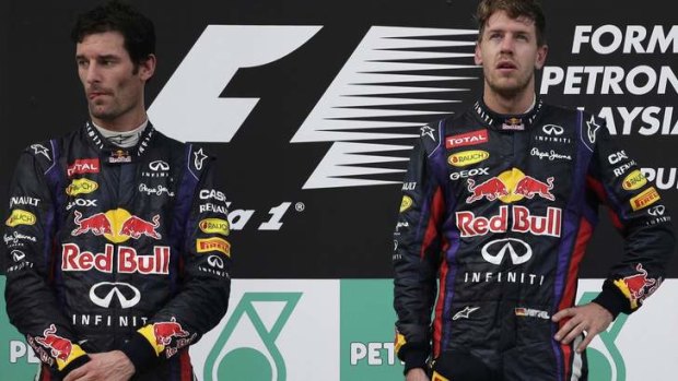 Angry: Mark Webber stands next to Sebastian Vettel on the podium.
