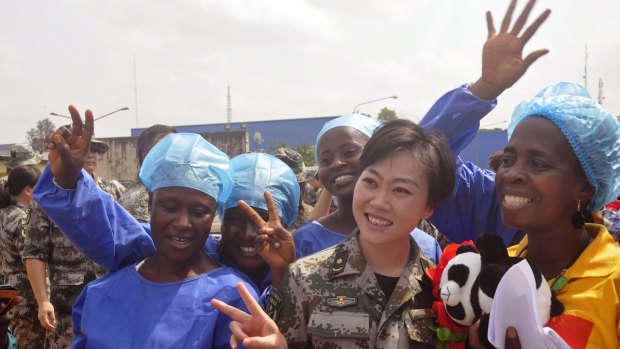 Beatrice Yardolo, right, celebrates her recovery from Ebola after treatment at a Chinese medical centre in Monrovia. 