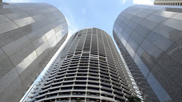 The Grosvenor Place skyscraper towers over entrance columns and the complex's courtyard in central Sydney.