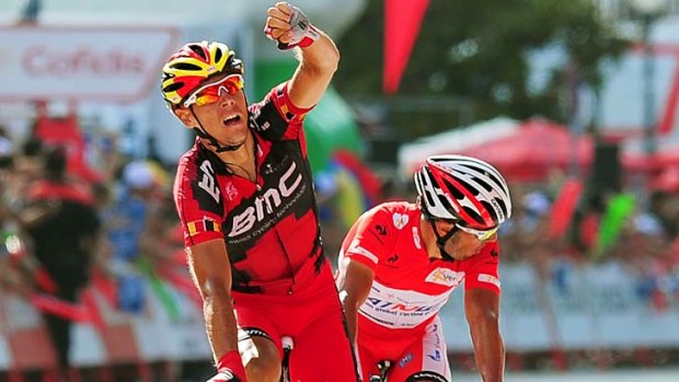 Belgium's Philippe Gilbert (L) of BMC Racing team reacts as he crosses the finish line to win the ninth stage of the Vuelta tour of Spain.