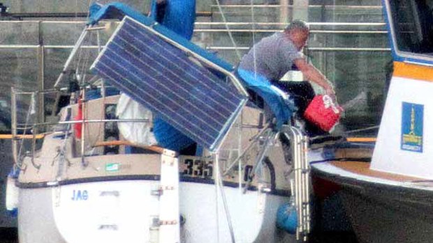 Top rater: A yachtsman in the midst of a 16-hour siege at Brisbane's CBD's waterfront.
