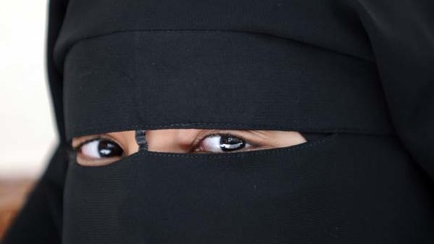 Banned ... A Muslim woman wearing the niqab just outside of Paris.