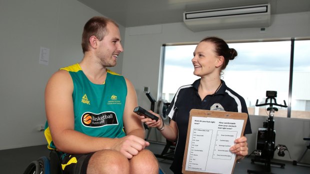 Australian wheelchair basketballer Tim Markcrow with University of Canberra Phd student Peta Forsyth at the Environmental Chamber at UC RISE building. She is researching the thermoregulation and cooling strategies of athletes with spinal cord injuries. 