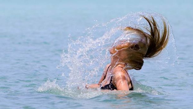 Make a splash ... swimming at Muri Beach, Rarotonga.