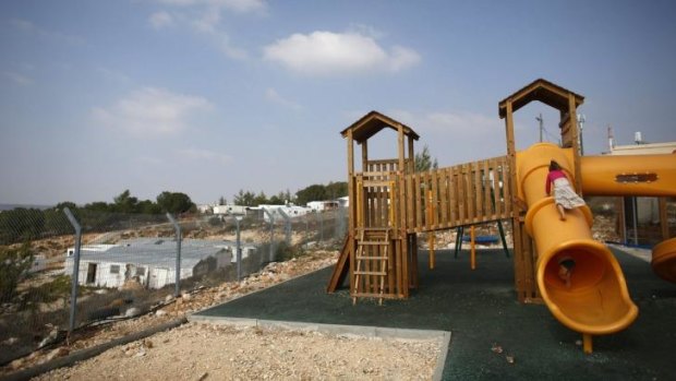 Contentious settlement ... Children climb on a slide at a playground in a Jewish settlement in the Etzion settlement bloc, near Bethlehem.