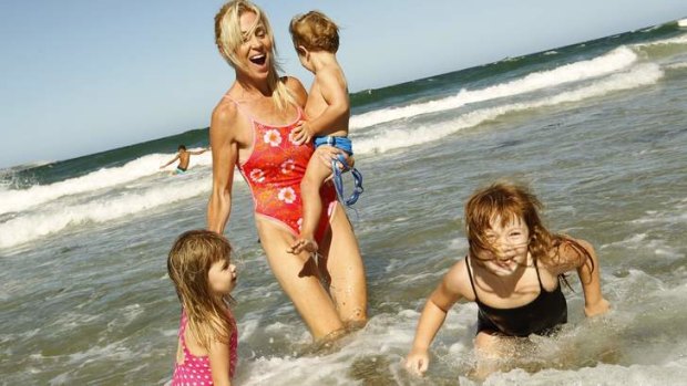 Going swimmingly: Susie Maroney with her children Capri, River and Paris at Cronulla Beach.