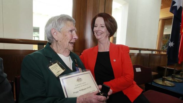 Prime Minister Julia Gillard presented Peggy Williams with a commemorative brooch at an event recognizing the service of the Australian Women's Land Army in Canberra.
