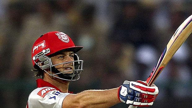 Kings XI Punjab's Adam Gilchrist celebrates his half century during the Indian Premier League cricket match against Chennai Super Kings in Dharmsala.