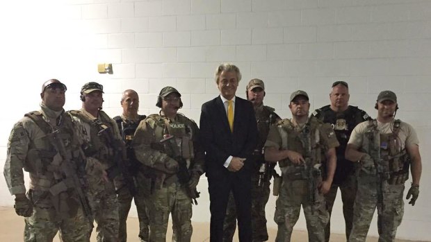 Dutch politician Geert Wilders with some of the police who responded to the attack. 
