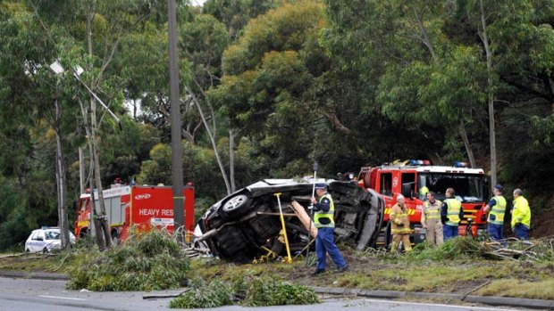 Police and emergency services officers at the scene of a fatal crash on Springvale Road at Glen Waverley.