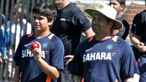 In good hands ... Sachin Tendulkar with his son Arjun at the SCG practice nets.