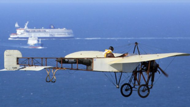 Centenary . . . Edmond Salis of France flies a replica Bleriot across the Channel to Dover.