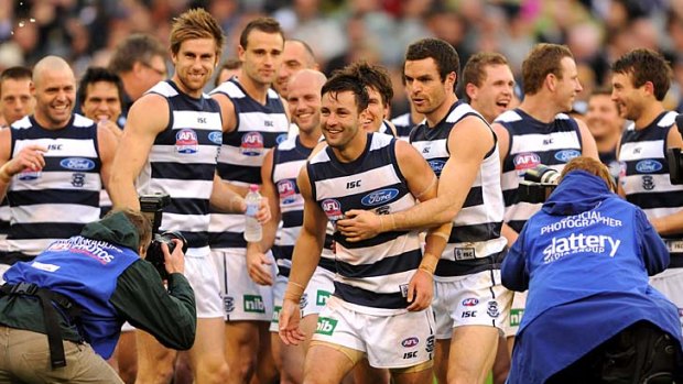 Finest feline: Geelong's Jimmy Bartel (centre) is congratulated by teammates after winning the Norm Smith Medal.