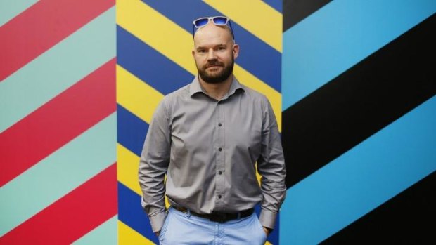 Sydney Festival director Lieven Bertel in front of a Maser artwork at the festival launch on Thursday.