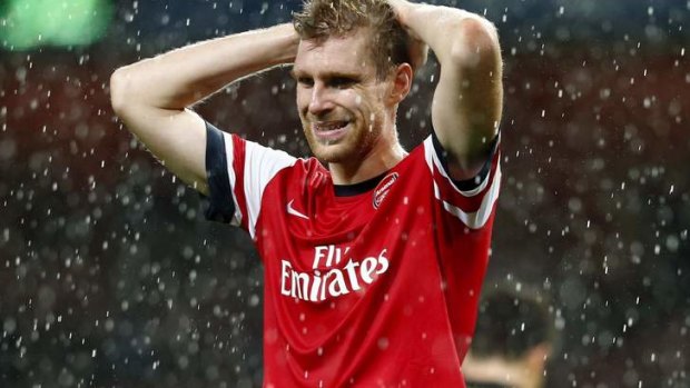 Per Mertesacker reacts to the final whistle.