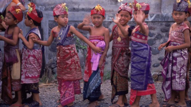 Local children taking part in a Temple Festival, Bali.