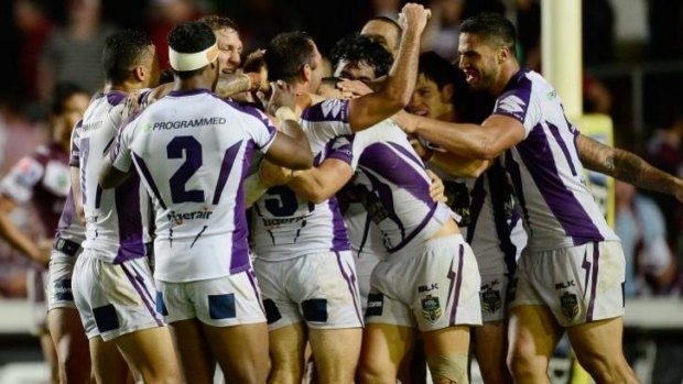 The Storm celebrates their win by golden point against Manly.