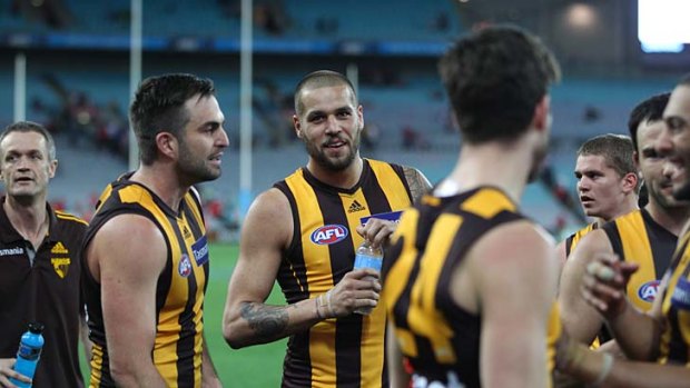 Lance Franklin celebrates with teammates after the game against Sydney.