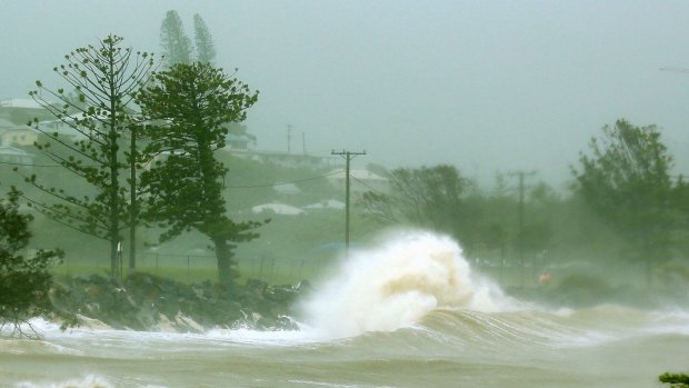 Waves crash into a breakwall after Tropical Cyclone Marcia made landfall near Yeppoon.